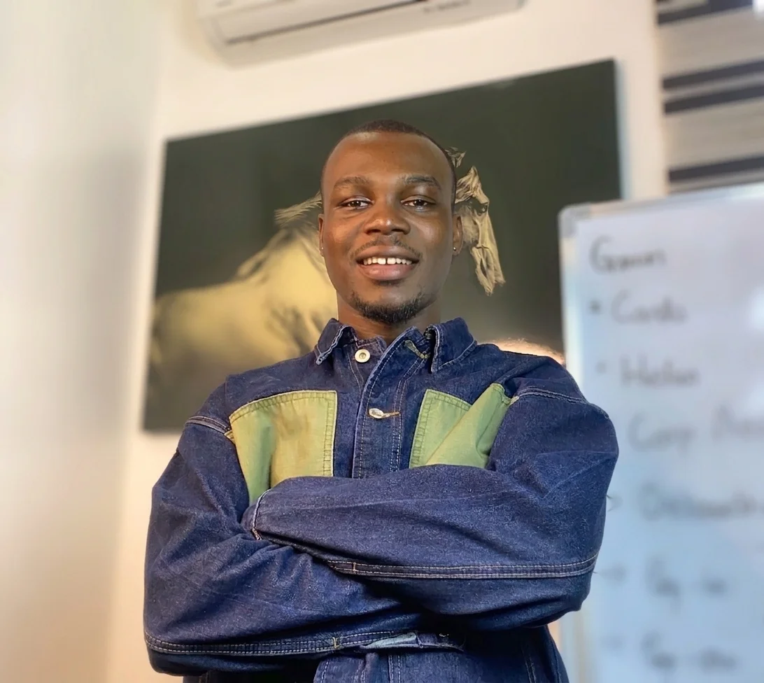 Ejeh Daniel wearing a burgundy suit outdoors